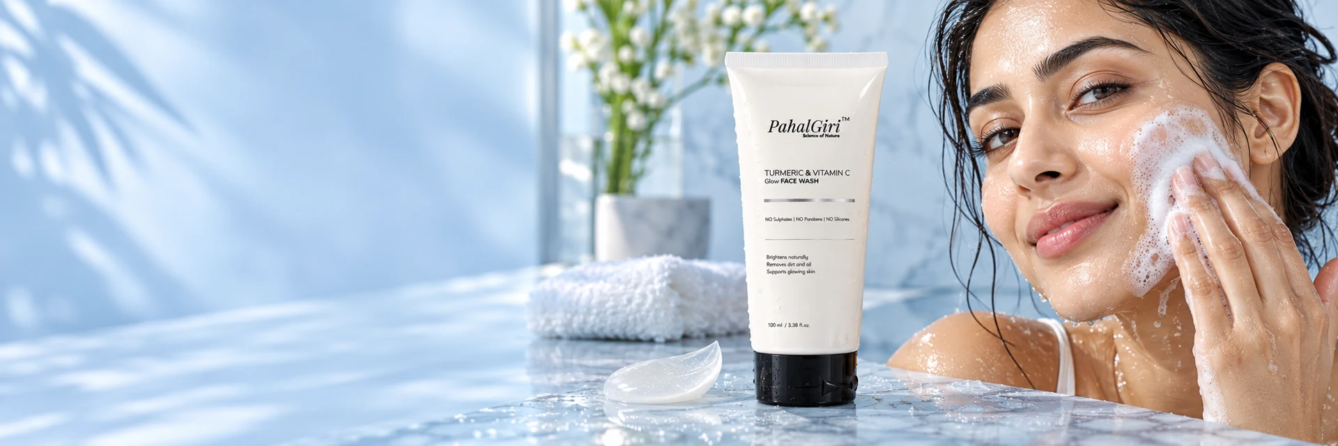 Illustrative model gently cleansing her cheek with PahalGiri face wash